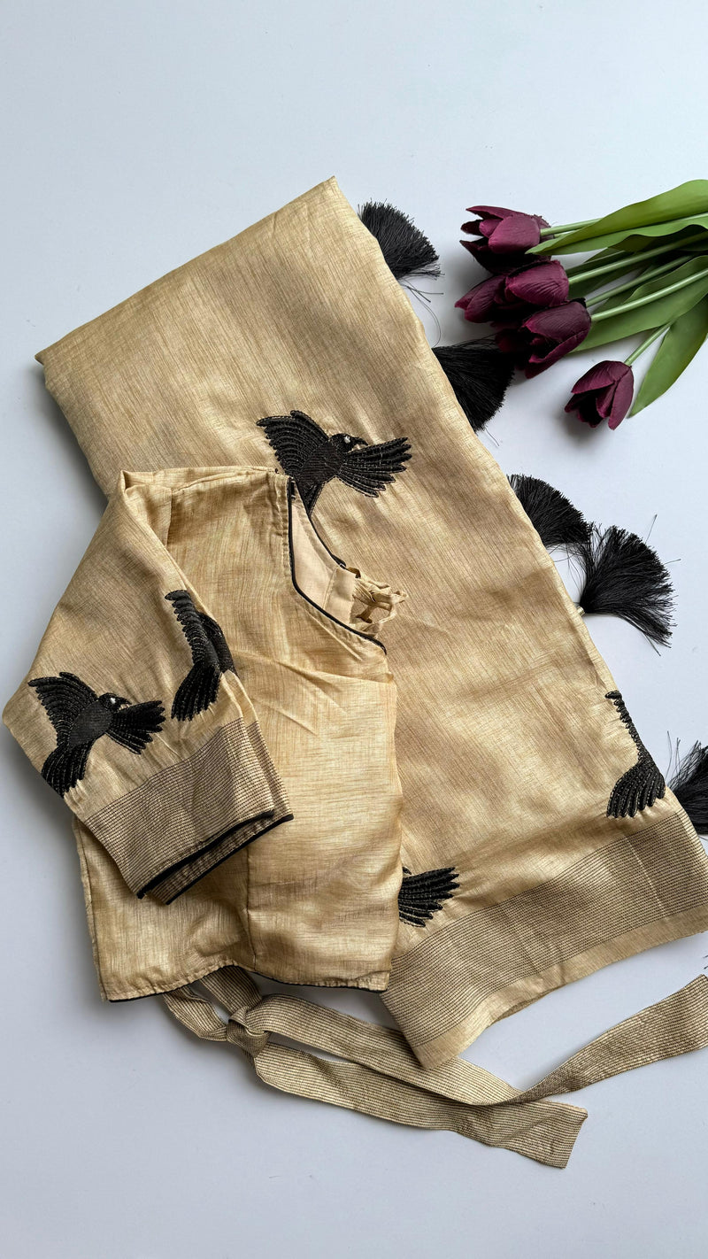 Beige Silk Blend Saree with Black Bird Embroidery & Tassels