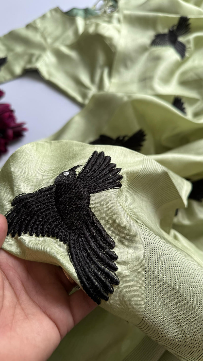 Pastel Green Silk Blend Saree with Black Bird Embroidery & Tassels