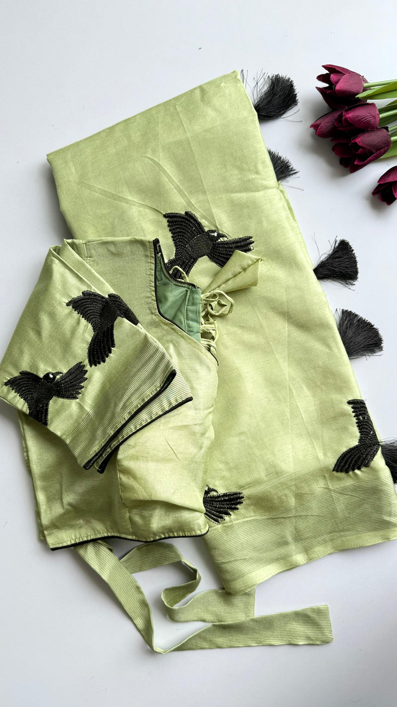 Pastel Green Silk Blend Saree with Black Bird Embroidery & Tassels